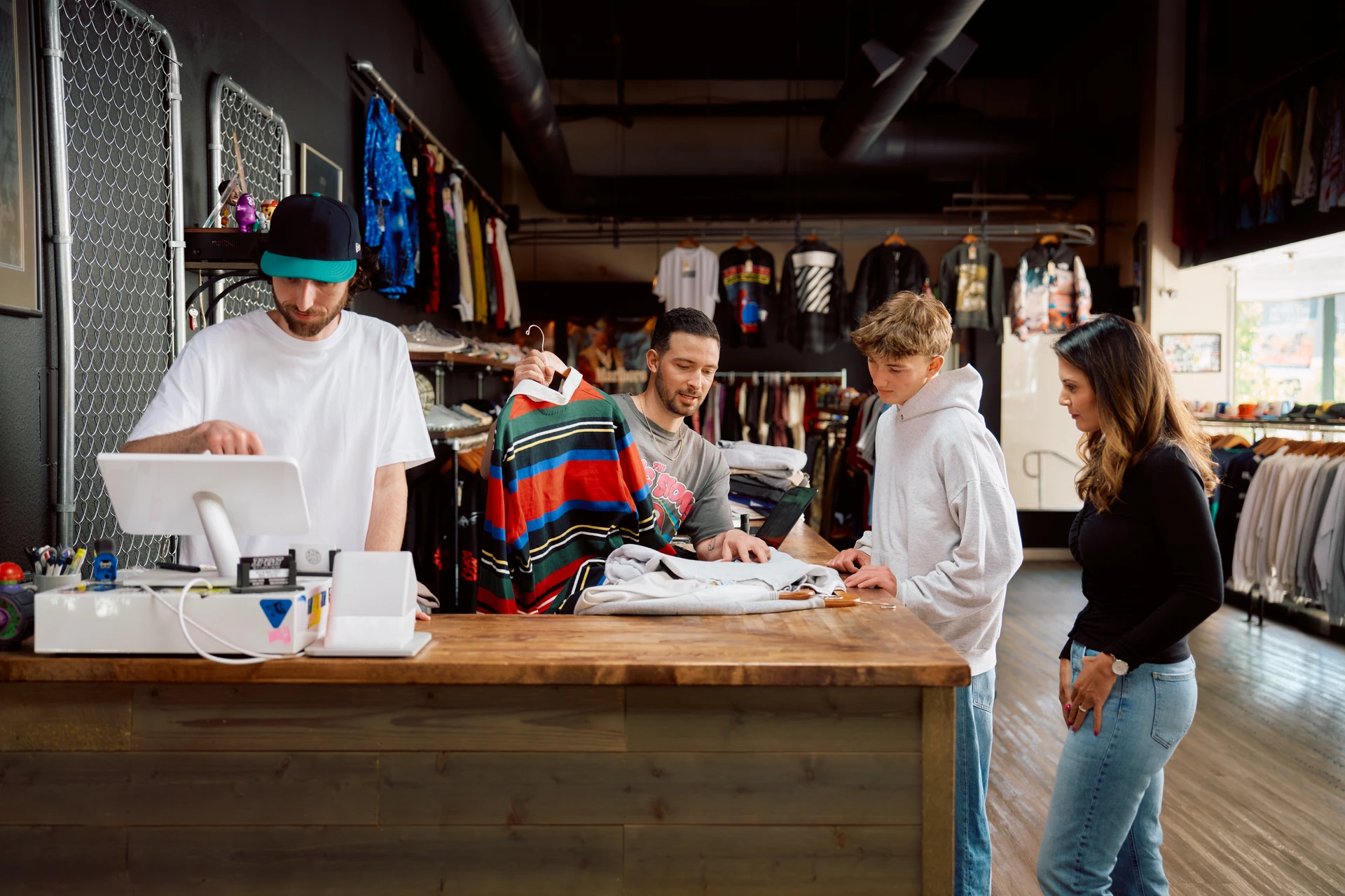 Ricochet team helping customers at a consignment store checkout